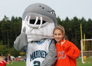 Stuey the Sturgeon poses with a young fan out in the community. Photo courtesy Bruce Hunter