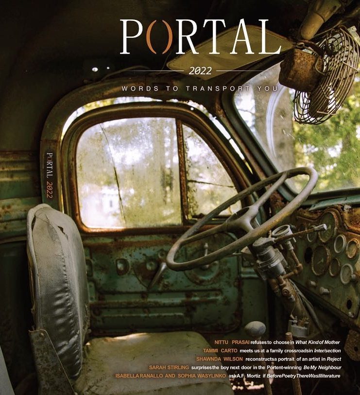 the cover of Portal 2022. A rusted out interior of a truck.