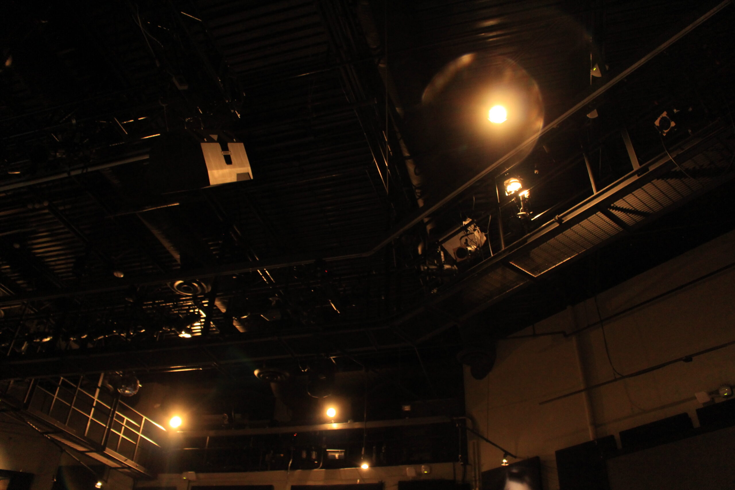A lit catwalk inside of the Malaspina Theatre.